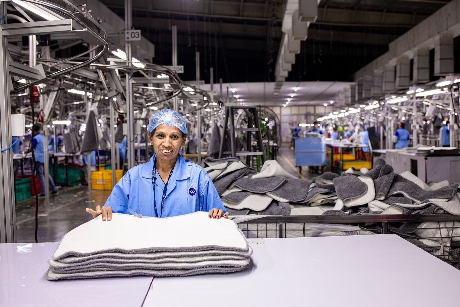 Workers on a factory production floor